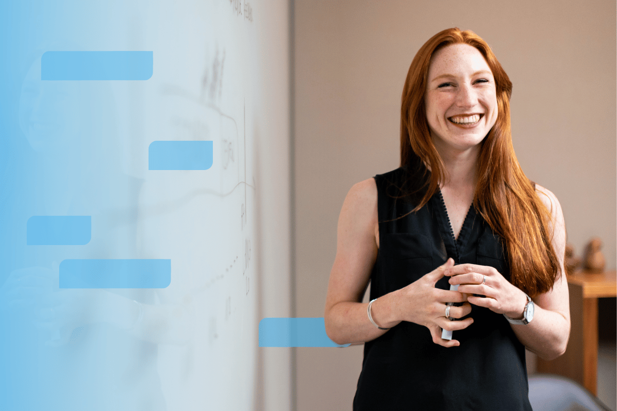 A Smiling Business Woman in front of a white board